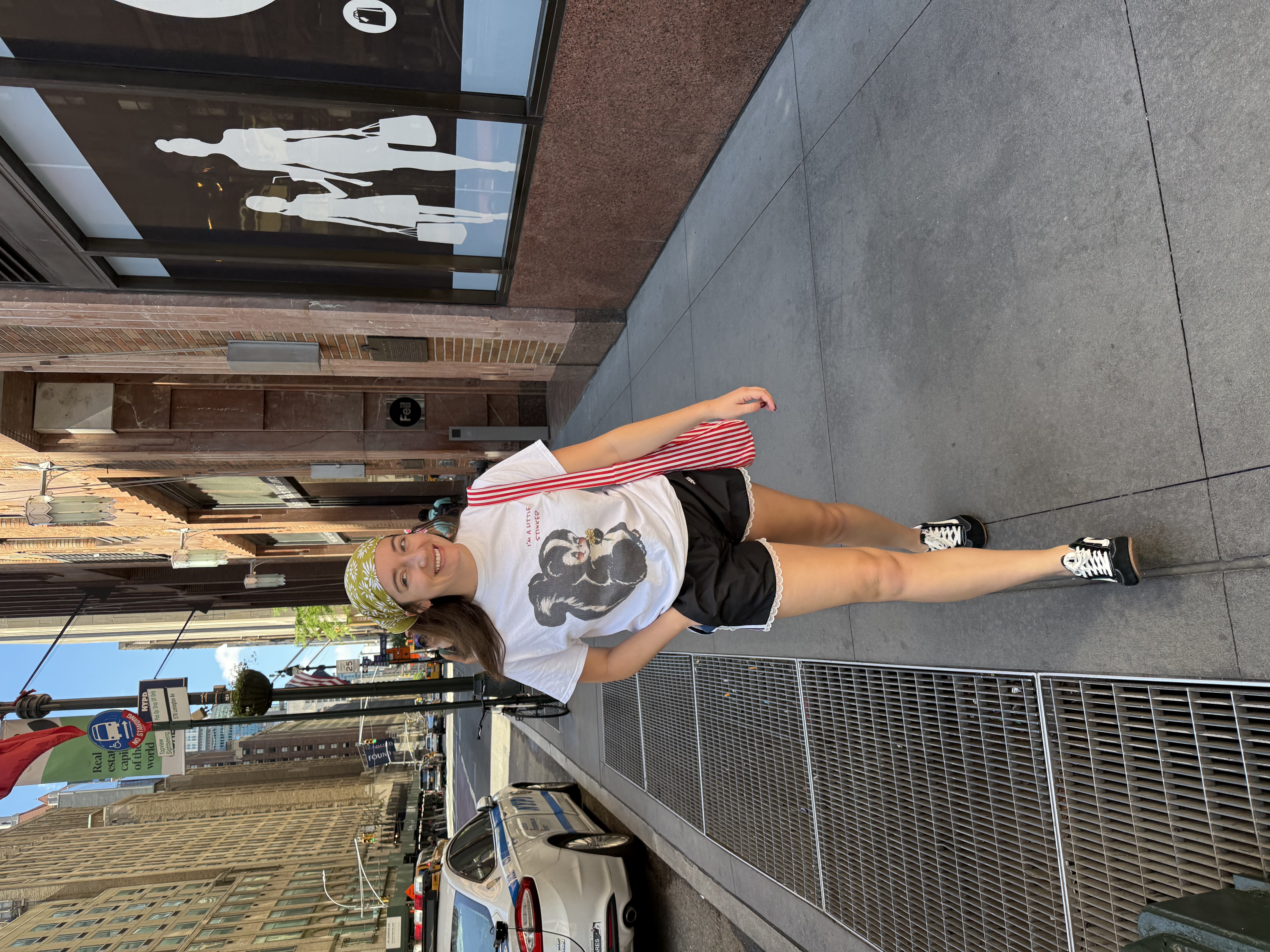 Emily strutting in New York in lace-trim Adidas shorts made from thrifted sweatpants